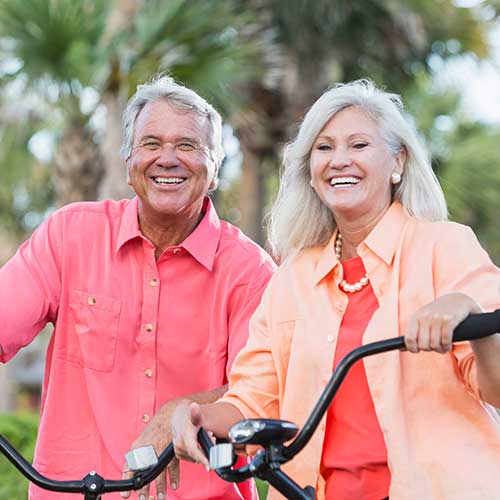 Happy couple enjoying life with hearing aids